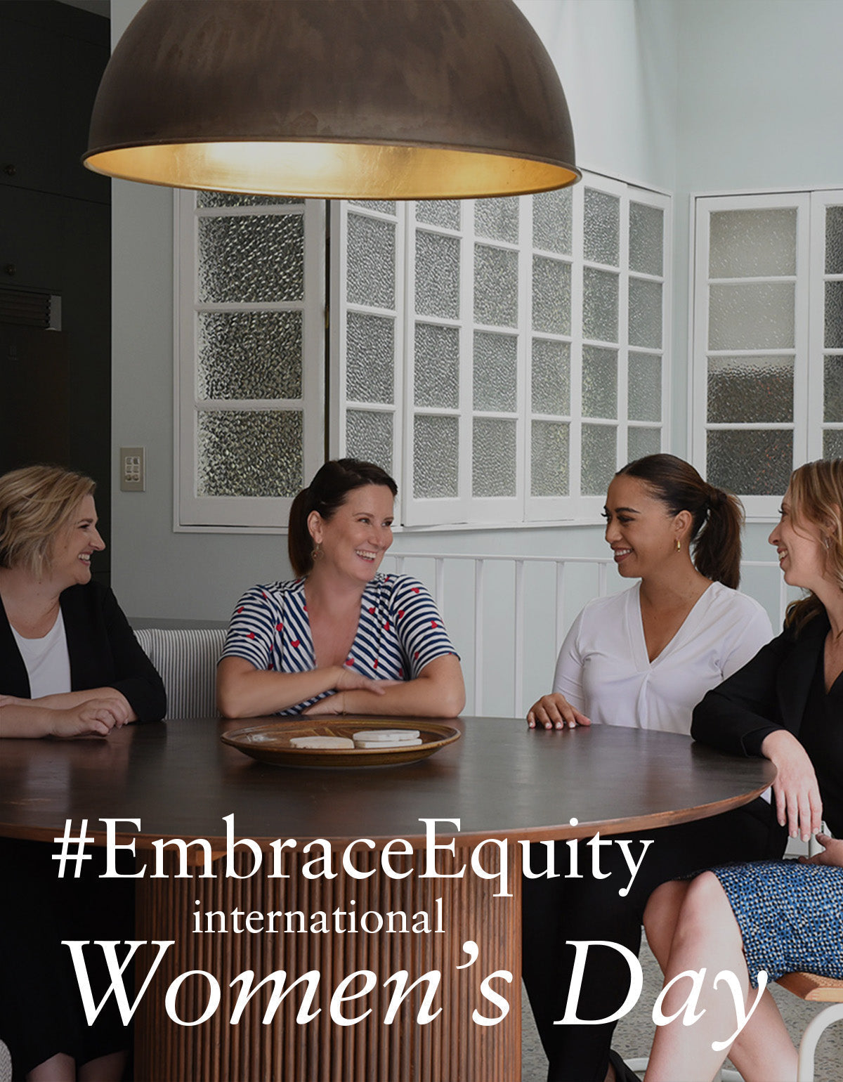 women form Australian and New Zealand women's clothing brand, L&F, gathered around a table sharing stories of equity, diversity and gender parity in the workplace for IWD23 #EmbraceEquity 