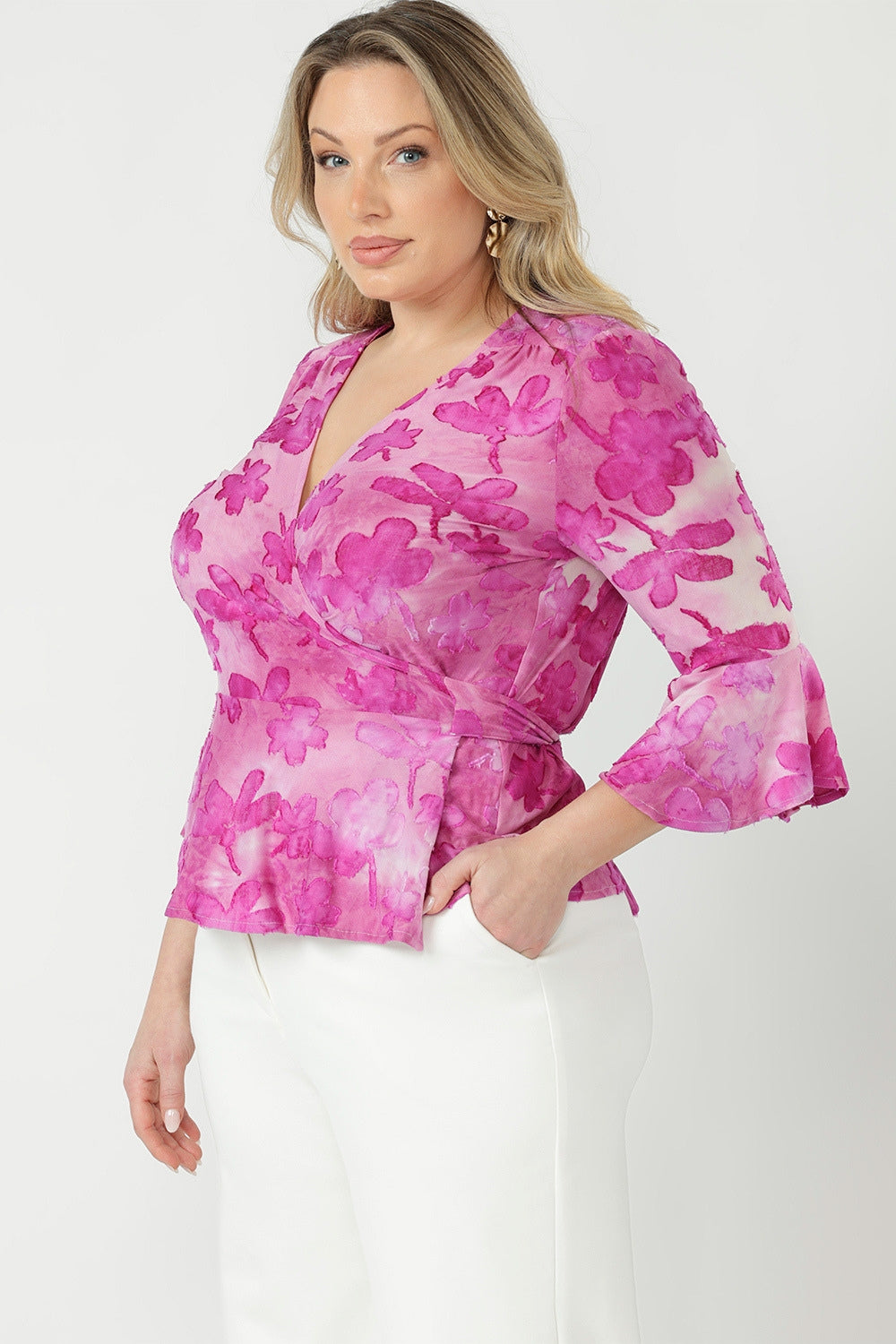 Australian-made Amora Top featuring a flattering wrap front, adjustable waist ties and soft peplum shape crafted from luxe stretch burnout fabric.