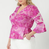 Australian-made Amora Top featuring a flattering wrap front, adjustable waist ties and soft peplum shape crafted from luxe stretch burnout fabric.