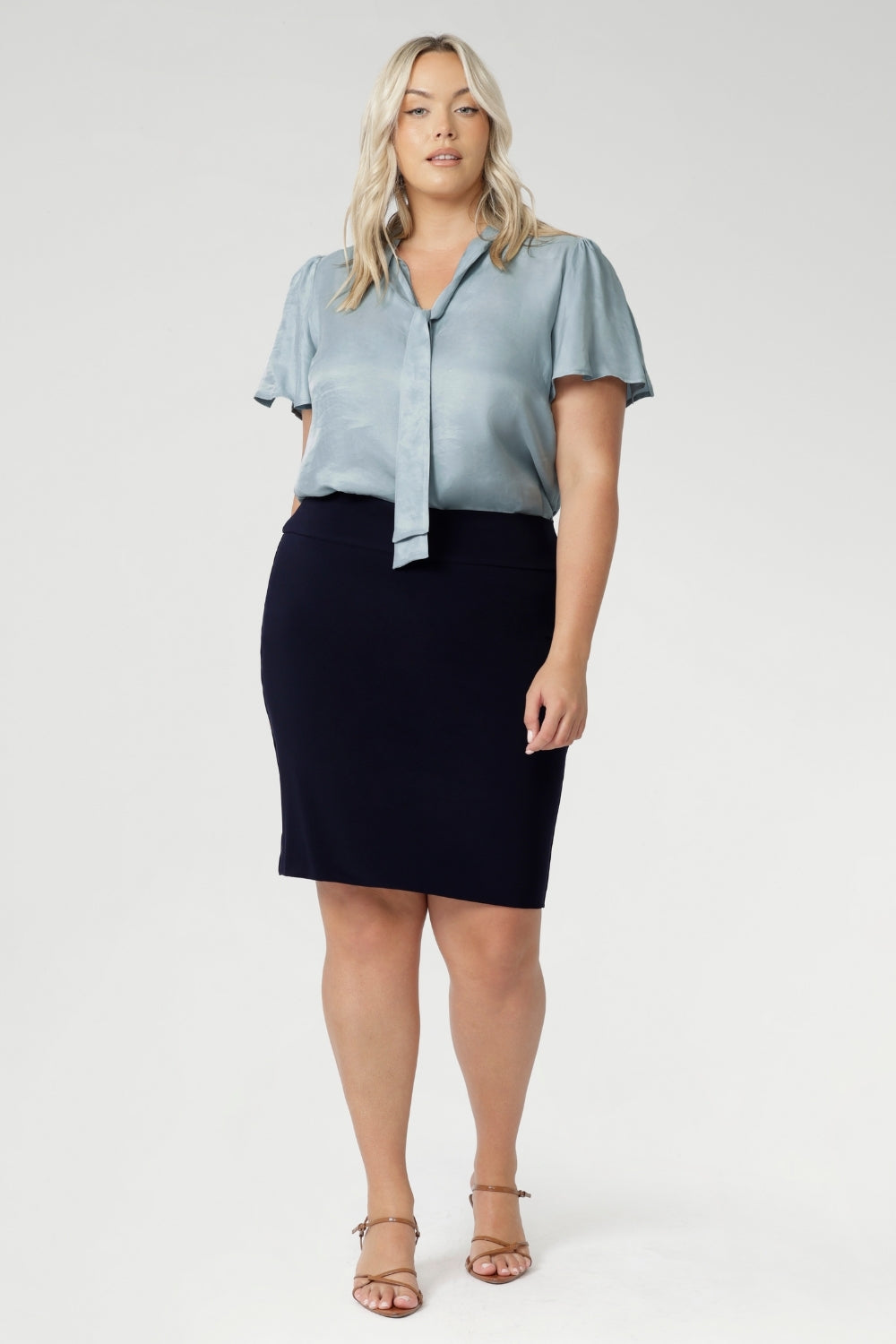 Crafted from a navy dry-touch jersey fabric with a soft stretch, this skirt offers both comfort and style. The double-layer design ensures a flattering fit, while the soft folded waistband adds extra comfort. Featuring a convenient pull-on style, the Andi Tube Skirt is available in a mini length for a bold and stylish look.
