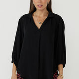 Crafted from a Tencel-Viscose fabric with a sand-washed texture, the Arley Shirt in Graphite features a buttonless design with clean lines, and a cool, contemporary look. Its versatile style makes it perfect for tucking into pants or skirts with ease.