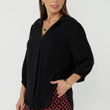Graphite features a buttonless design with clean lines, and a cool, contemporary look. Its versatile style makes it perfect for tucking into pants or skirts with ease.