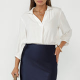 Crafted from a Tencel-Viscose fabric with a sand-washed texture, the Arley Shirt in Vanilla features a buttonless design with clean lines, and a cool, contemporary look.