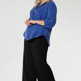 The Arley Shirt in Vivid Blue is a modern wardrobe staple that blends understated elegance with all-day comfort. Crafted from a luxurious suede-touch Tencel fabric, this buttonless, pull-on style offers a clean, contemporary silhouette that’s perfectly suited to office dressing and beyond. The semi-fitted shape creates a flattering line through the body, while the classic collar adds a sharp, structured touch.