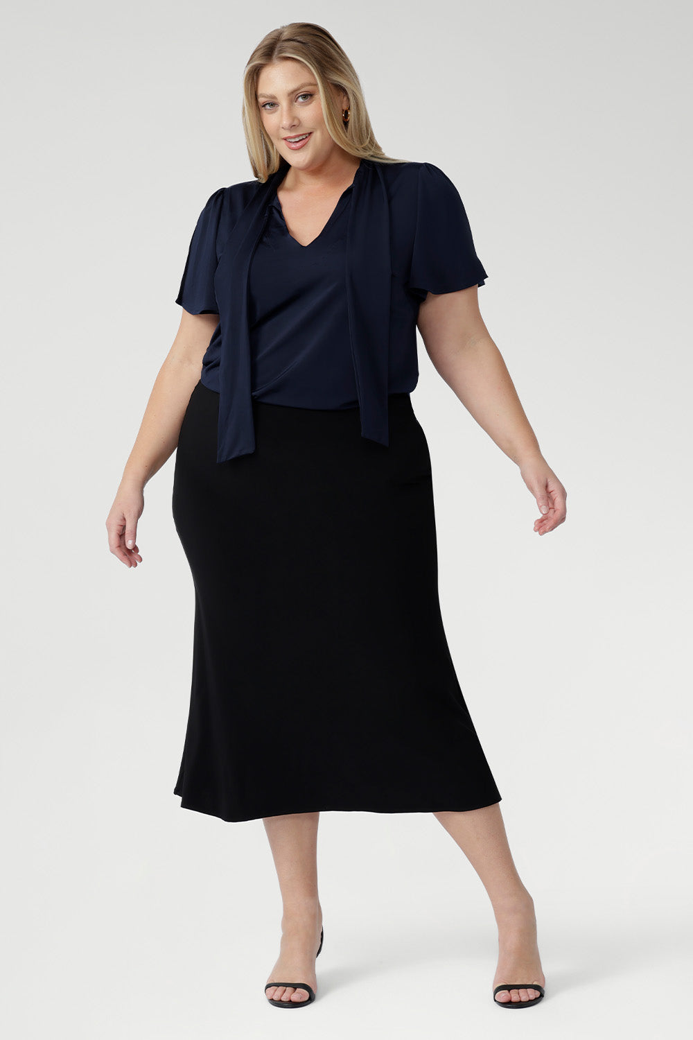 The Asher Skirt is your go-to for easy, elegant dressing. Made from our signature dry-touch stretch jersey, it offers a comfortable, flexible fit with a pull-on elastic waist and refined A-line silhouette. Designed for movement and all-day wear, this skirt transitions seamlessly from office to off-duty. Australian designed and made.
