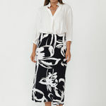 The Asher Skirt is a modern essential in women’s workwear Australia, crafted from our signature dry-touch stretch jersey for a smooth, comfortable fit that moves with you. 