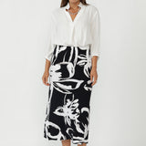 The Asher Skirt is a modern essential in women’s workwear Australia, crafted from our signature dry-touch stretch jersey for a smooth, comfortable fit that moves with you. 