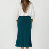 The Asher Skirt is crafted from signature dry-touch stretch jersey, combining effortless comfort with a sleek, flattering A-line silhouette for elevated everyday dressing. 