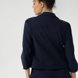 Navy workwear cropped jacket exudes sophisticated, modern tailoring, crafted from a luxe Scuba Crepe fabric. The fabric’s soft, textured feel and slight stretch provide both comfort and a flattering fit. 