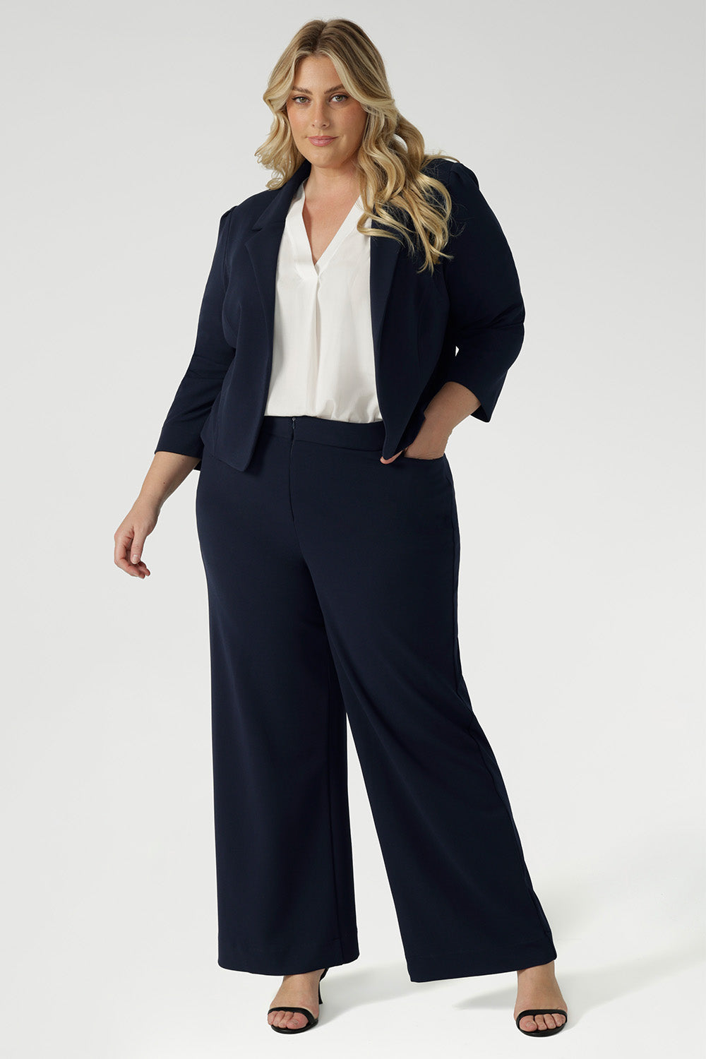 Navy workwear jacket features open-front design allowing for effortless styling, while the narrow collar and notch lapels add a touch of sharpness to its clean lines. 