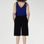 The knee-length cut delivers a flattering, versatile silhouette that moves seamlessly from casual days to elevated off-duty dressing.