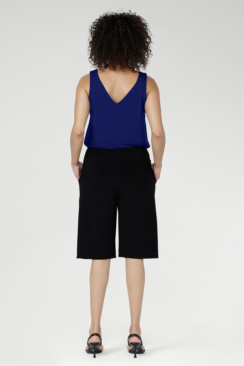 The knee-length cut delivers a flattering, versatile silhouette that moves seamlessly from casual days to elevated off-duty dressing.