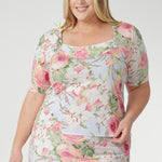The squared scoop neckline and structured bust offer a refined, modern shape, while the short sleeves with delicate tucks at the sleeve-head add subtle detail and elegance.