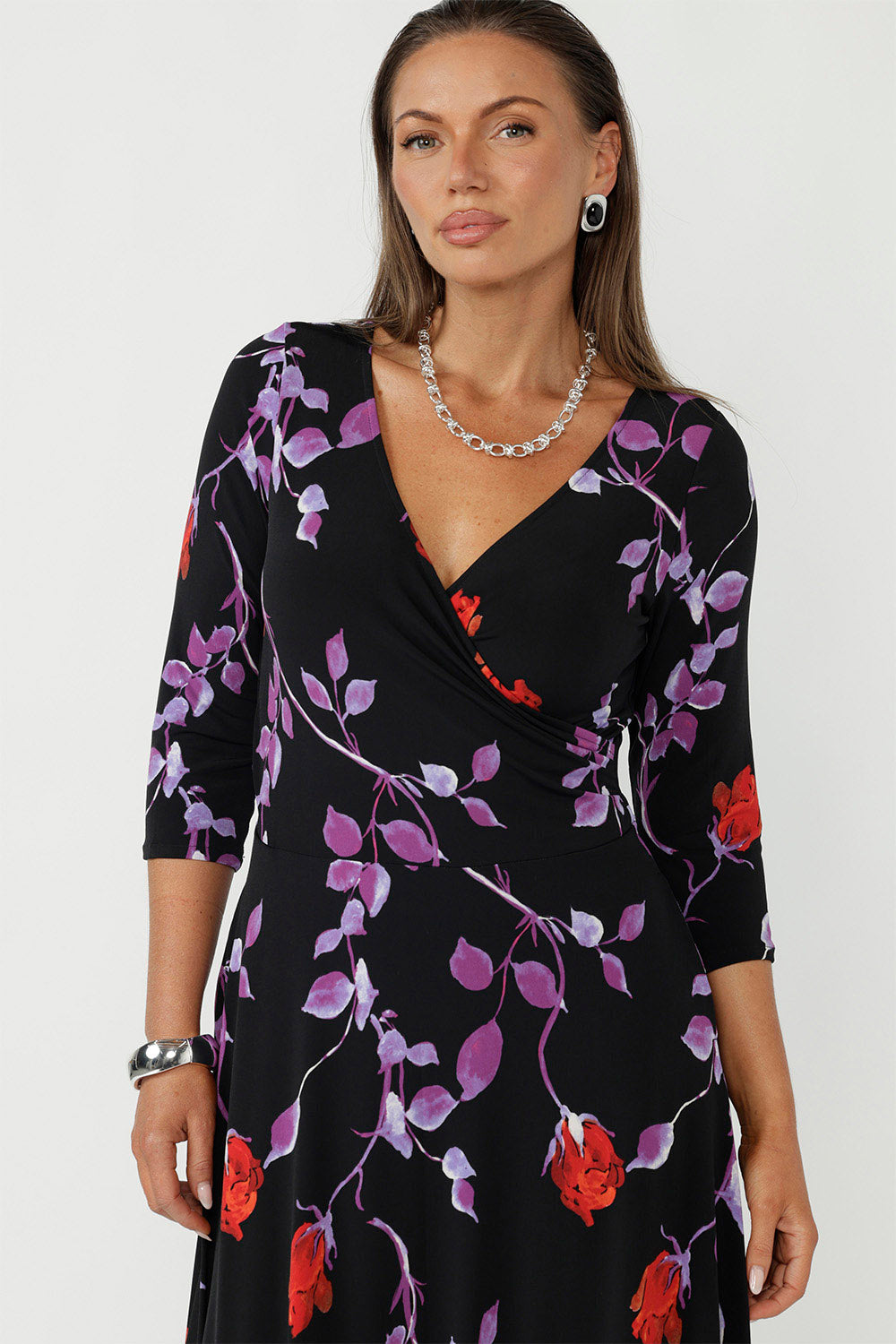 Flattering dress features a V neckline, 3/4 sleeves, and a flowing maxi skirt with ruffle hem. Proudly designed and made in Australia.