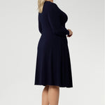 Available in sizes 8 to 24, this versatile piece is designed to flatter petite and plus-size women alike. Effortlessly layer it under a blazer or coat, or style it with stockings and boots during the cooler months for a chic, season-ready look.