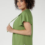 Naturally cool and silky on the skin, it features a relaxed silhouette with a flattering V-neckline and subtle pleat detailing for elevated comfort.
