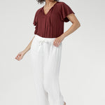 Cool, smooth, and naturally lightweight on the body, it features a relaxed silhouette with a flattering V-neckline and subtle pleat detailing.
