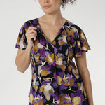 The Bowie Top is a wardrobe essential that blends comfort, style, and versatility in one effortless piece. Crafted from our signature dry-touch stretch jersey, this top features a flattering V-neckline with delicate fabric ties that can be worn open for a relaxed look or tied for a touch of vintage charm.