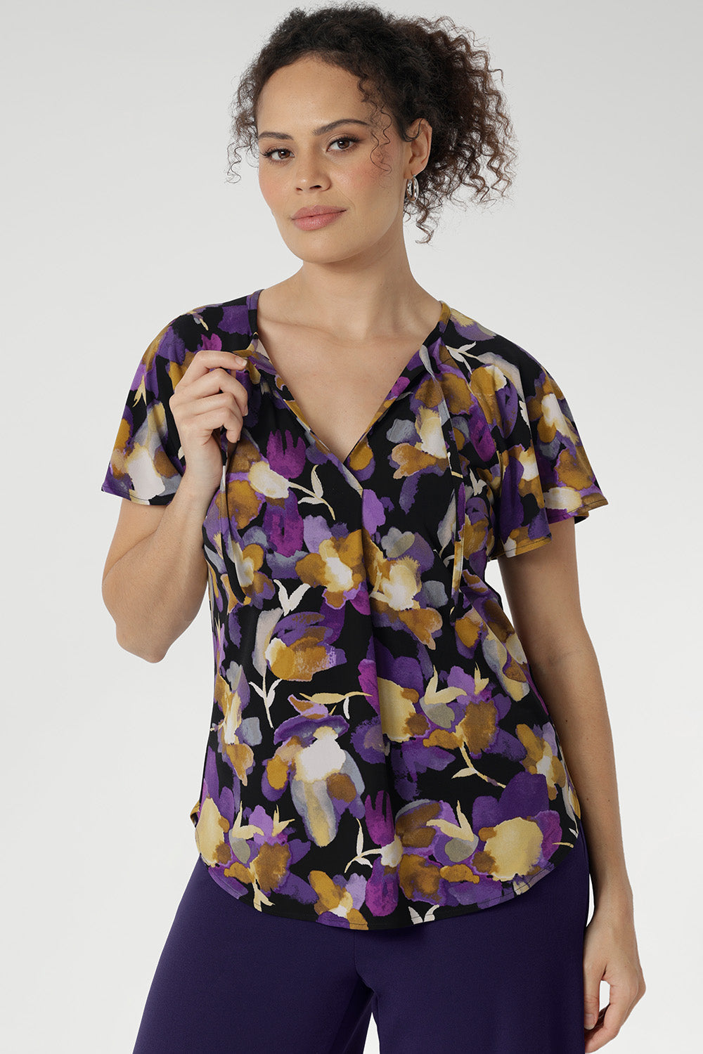 The Bowie Top is a wardrobe essential that blends comfort, style, and versatility in one effortless piece. Crafted from our signature dry-touch stretch jersey, this top features a flattering V-neckline with delicate fabric ties that can be worn open for a relaxed look or tied for a touch of vintage charm.