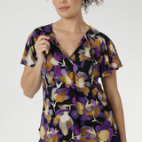The Bowie Top is a wardrobe essential that blends comfort, style, and versatility in one effortless piece. Crafted from our signature dry-touch stretch jersey, this top features a flattering V-neckline with delicate fabric ties that can be worn open for a relaxed look or tied for a touch of vintage charm.