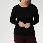 Stay effortlessly stylish through the cooler months with this luxuriously soft knit top, crafted from a premium Tencel wool blend. Designed for comfort and versatility, it features a flattering close-to-body fit that moves with you, thanks to its generous stretch and breathable finish. Black knit top has thumbholes that can be used or tucked away for versatility in styling and extra warmth. 