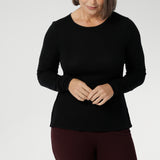 Stay effortlessly stylish through the cooler months with this luxuriously soft knit top, crafted from a premium Tencel wool blend. Designed for comfort and versatility, it features a flattering close-to-body fit that moves with you, thanks to its generous stretch and breathable finish. Black knit top has thumbholes that can be used or tucked away for versatility in styling and extra warmth. 