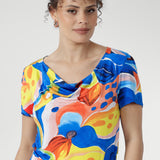 With its cowl neckline, relaxed blouson shape, and flowing asymmetrical skirt, this floral beauty is perfect for sunny days, seaside escapes, and easy weekends. Made in Australia, sizes 8–24.