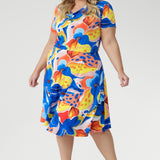 Crafted from our signature slinky jersey with a cool, silky feel and gentle stretch, the Casey Dress in Summer Bliss combines effortless comfort with feminine flair. Featuring a softly draped cowl neckline, blouson bodice, and an asymmetrical skirt, this piece is finished with shoulder-tucked sleeves and a striking floral print. A lightweight favourite for holidays, weekends, and sun-soaked days. Proudly made in Australia.