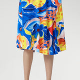 With a flattering cowl neckline, blouson bodice, and softly flowing asymmetrical skirt, it’s finished with delicate shoulder tucks and a vibrant floral print. Perfect for holidays, casual weekends, or any warm summer day. Made in Australia, sizes 8–24.