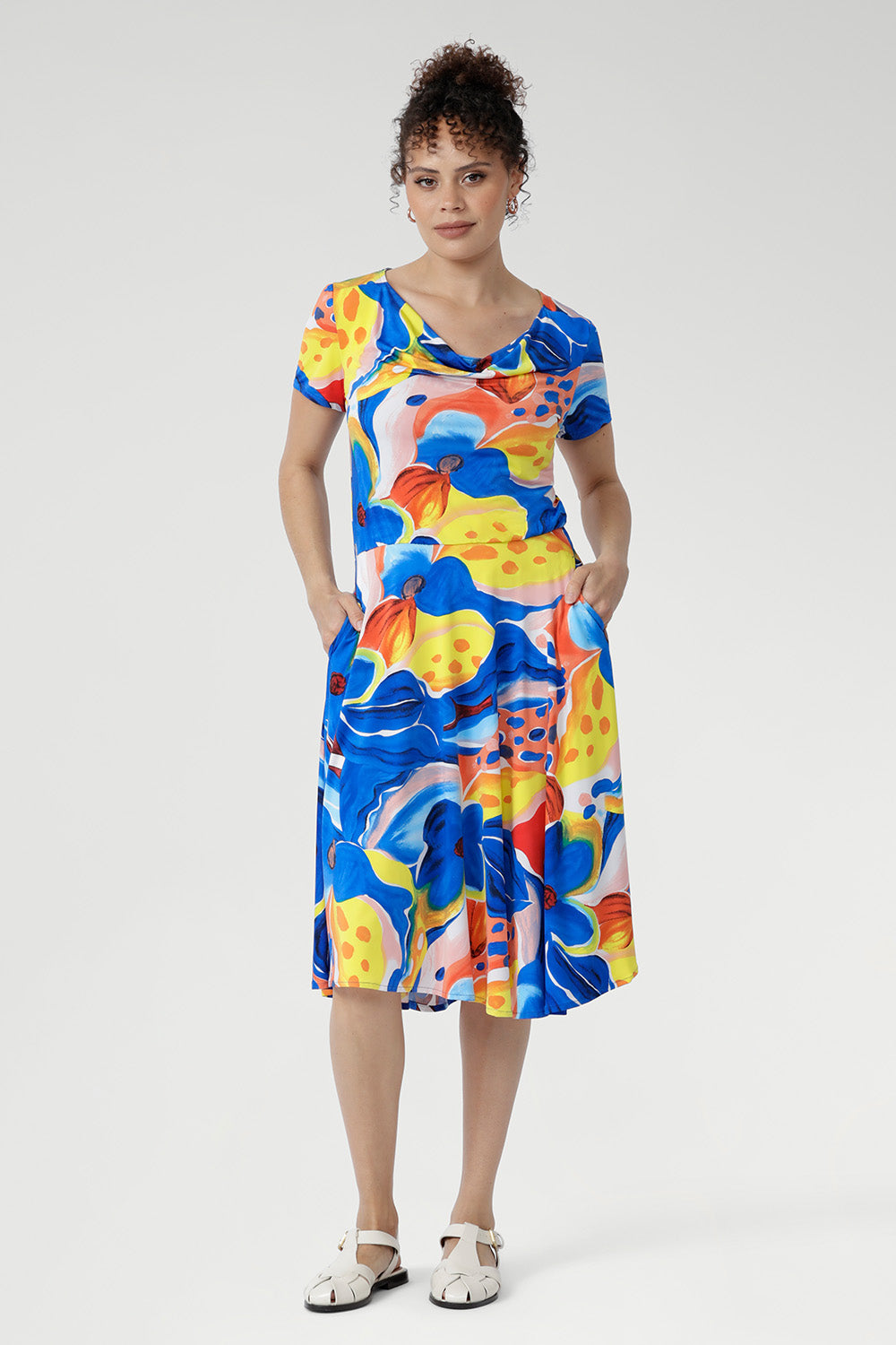 Feel cool, confident, and effortlessly put-together in the Casey Dress in Summer Bliss. Crafted from our signature slinky jersey, it offers a soft stretch and refreshing touch against the skin. With its cowl neckline, relaxed blouson shape, and flowing asymmetrical skirt, this floral beauty is perfect for sunny days, seaside escapes, and easy weekends. Made in Australia, sizes 8–24.