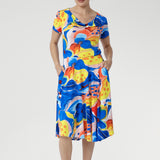 Feel cool, confident, and effortlessly put-together in the Casey Dress in Summer Bliss. Crafted from our signature slinky jersey, it offers a soft stretch and refreshing touch against the skin. With its cowl neckline, relaxed blouson shape, and flowing asymmetrical skirt, this floral beauty is perfect for sunny days, seaside escapes, and easy weekends. Made in Australia, sizes 8–24.