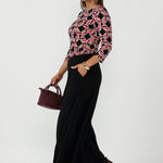 Stylish Collins Top crafted from premium dry-touch stretch jersey, featuring a sophisticated geometric print, bust darts, 3/4 sleeves and an elegant boat-neck silhouette.