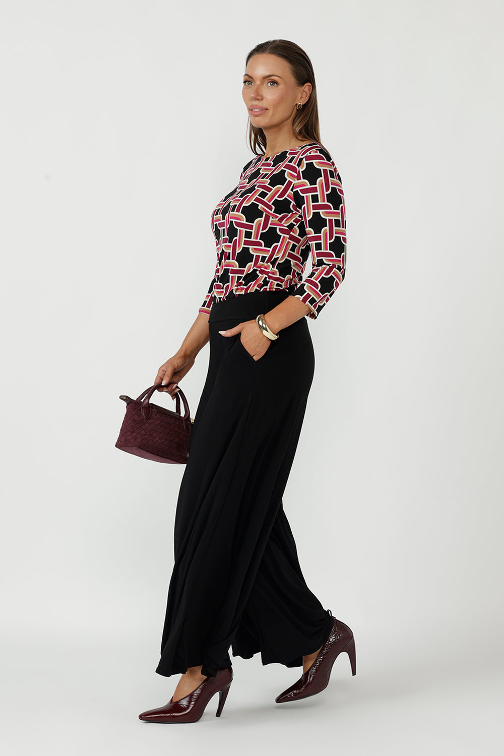Stylish Collins Top crafted from premium dry-touch stretch jersey, featuring a sophisticated geometric print, bust darts, 3/4 sleeves and an elegant boat-neck silhouette.