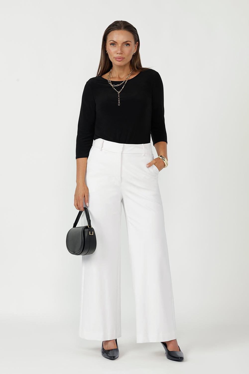 Elegant Collins Top crafted from luxe dry-touch stretch jersey with a close-to-body silhouette, refined boat neckline and effortless layering versatility.