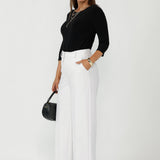 Australian-made Collins Top with a polished boat-neck design, soft dipped hemline and comfortable stretch jersey for elevated everyday wear.