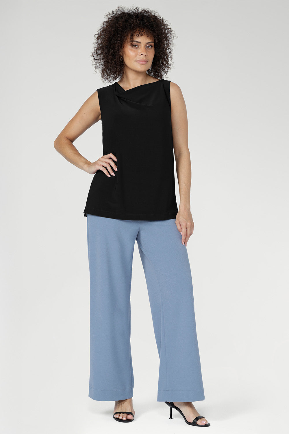  Smooth on the body, it features a softly draped cowl neckline and bust darts for subtle shaping. Side panel detailing refines the silhouette, with an optional belt for adjustable styling. Made in Australia.