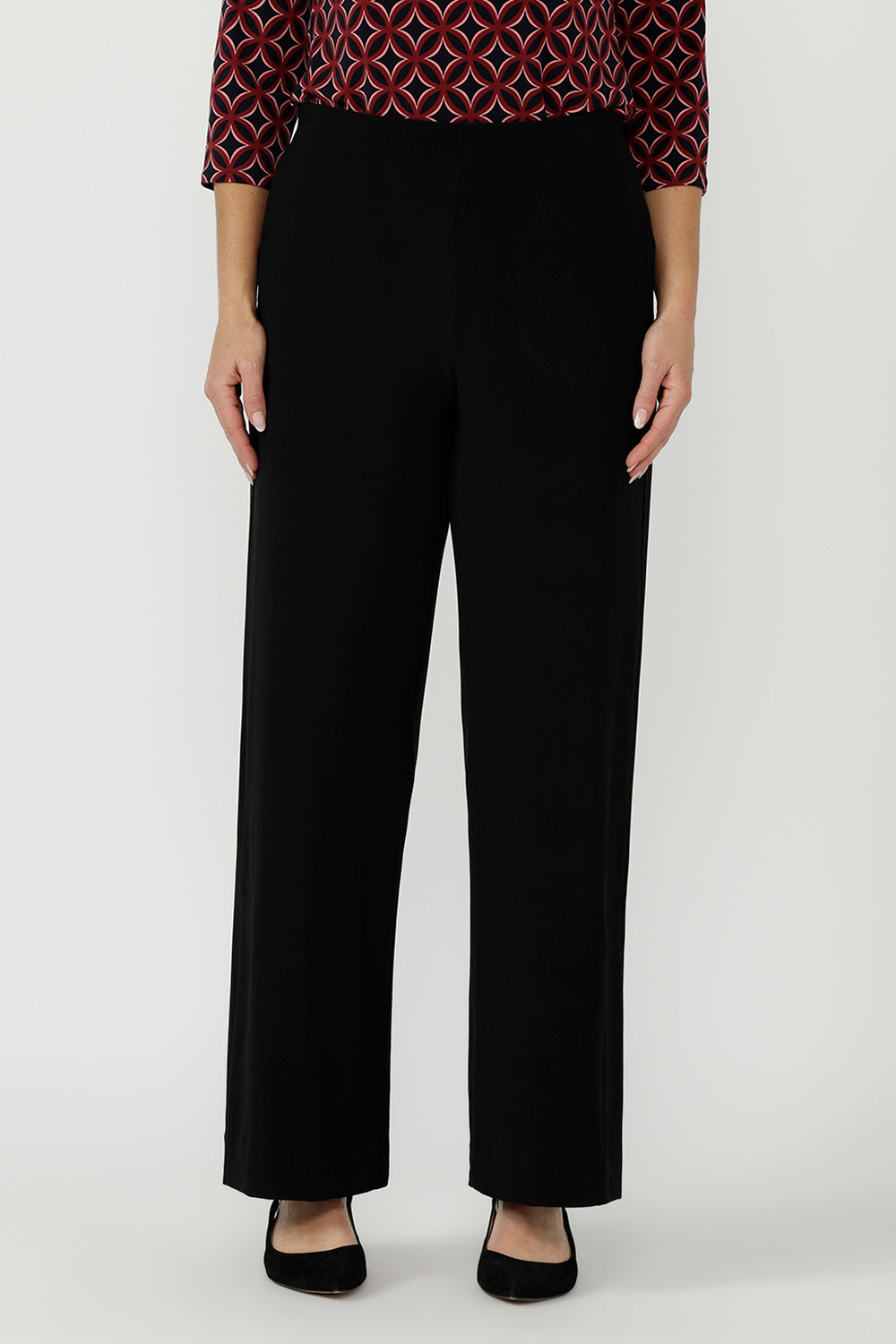 Modern women's top in soft stretch dry-touch jersey with a satin-trimmed keyhole neckline, curved hemline and tailored fit for effortless work-to-weekend styling.