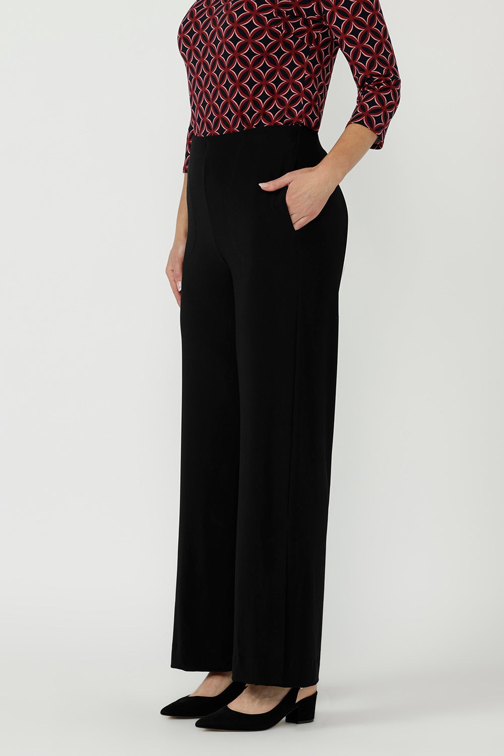 Premium dry-touch jersey top with soft stretch, a satin-bound keyhole neckline, curved hem and elegant fitted design for versatile office and occasion wear.