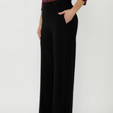 Premium dry-touch jersey top with soft stretch, a satin-bound keyhole neckline, curved hem and elegant fitted design for versatile office and occasion wear.