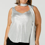 A shimmering jersey neck tie in sterling silver puts the finishing touch to matching cami top for an evening event look. Made in Australia by women's clothing and occasionwear brand, L&F.