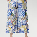 Meet the Dany Culotte in Mosaic Tile — your new go-to wide-leg jersey pant for effortless style and comfort. Crafted from our soft-touch stretch jersey with a silky-smooth feel, this design features a bold mosaic print inspired by Sicilian tilework, blending cobalt, yellow, brown, and green tones over a fresh white base.