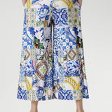 Meet the Dany Culotte in Mosaic Tile — your new go-to wide-leg jersey pant for effortless style and comfort. Crafted from our soft-touch stretch jersey with a silky-smooth feel, this design features a bold mosaic print inspired by Sicilian tilework, blending cobalt, yellow, brown, and green tones over a fresh white base.