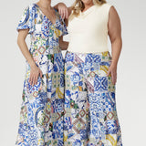 Inspired by Mediterranean charm, the Dany Culotte in Mosaic Tile is crafted from our signature soft-touch stretch jersey, offering luxurious comfort and elegant flow. The intricate mosaic print, featuring shades of cobalt, yellow, brown, and green, adds vibrancy to the clean white base. Designed with a pull-on elastic waistband, wide cropped legs, and functional pockets, it combines ease of wear with refined detail.