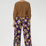 Designed with a double-layer pull-on waistband and functional side pockets with chic visible stitching, the Dany Culotte blends fashion and function seamlessly. Size 10 model wears her culottes with woven blouse tucked in and brown boots. 