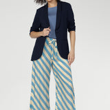 Functional side pockets add everyday practicality, while subtle hem slits enhance movement and flow. Pair back with Merit Blazer for a polished look