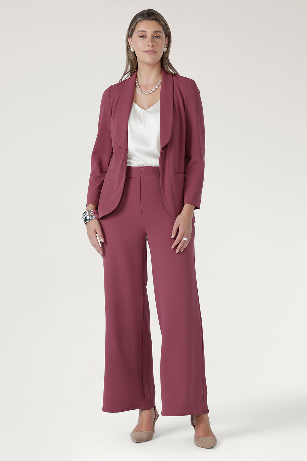 The straight-cut wide-leg profile adds a contemporary edge, while angled front pockets and back darts provide both function and subtle shaping.