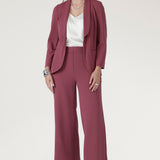 The straight-cut wide-leg profile adds a contemporary edge, while angled front pockets and back darts provide both function and subtle shaping.
