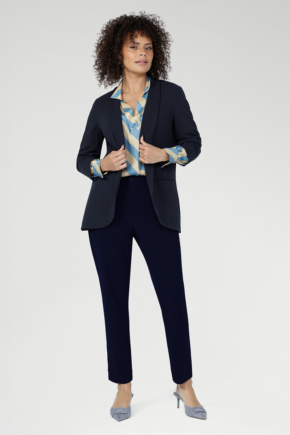 The Ellis Shirt is crafted from luxurious Italian viscose in a smooth sateen weave, offering a silky, fluid drape that moves beautifully on the body. 