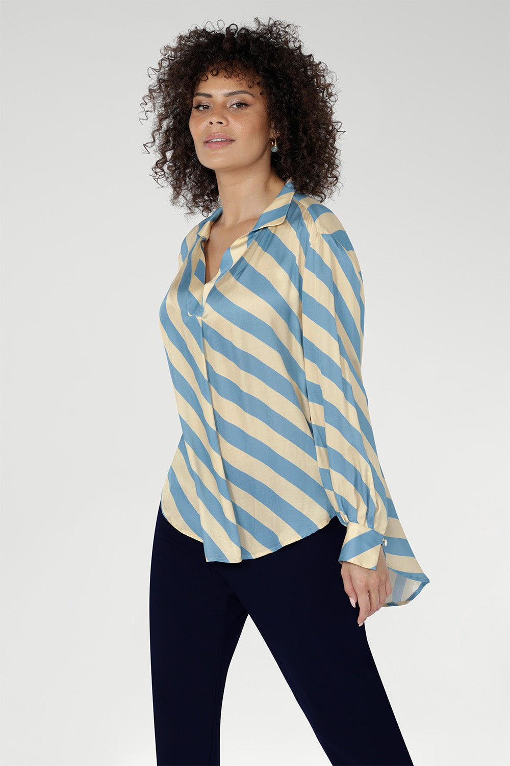 The elegant Blue Sky Stripe print blends soft sky blue and vanilla tones, delivering a fresh yet timeless look. Sizes 8-24