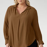 Designed to be worn untucked or styled with a front or back tuck, it transitions seamlessly from relaxed to refined. Crafted from a breathable Tencel Viscose, the fabric has a soft drape and a gentle texture. It’s lightweight, easy to wear, and holds its shape without stretch. In the warm neutral shade of Nuthatch, it brings subtle sophistication to everyday dressing.